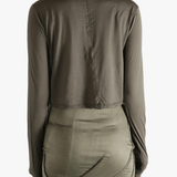 Brown t-shirts worn by a person, showing the t-shirts fit