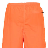 Orange shorts, back view showing relaxed fit