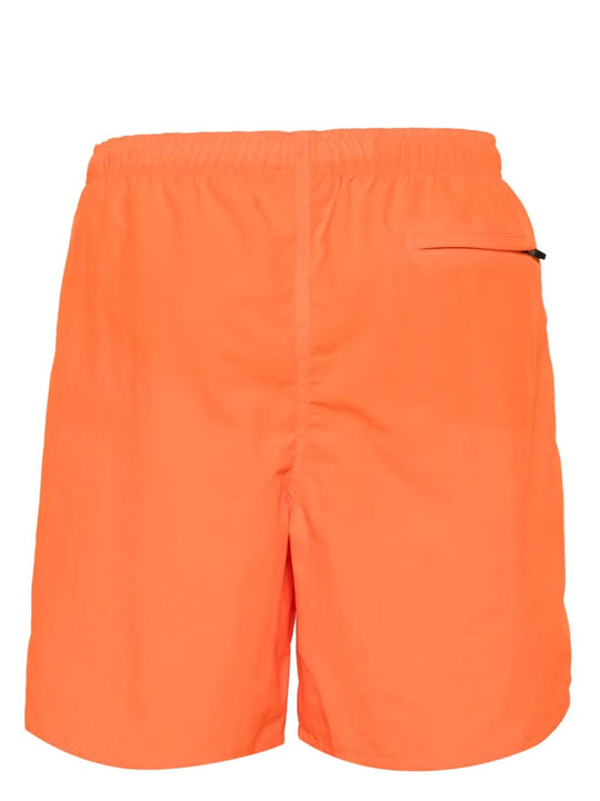 Orange shorts, back view showing relaxed fit