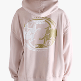 Pink hoodie worn by a person, showing the hoodie's fit