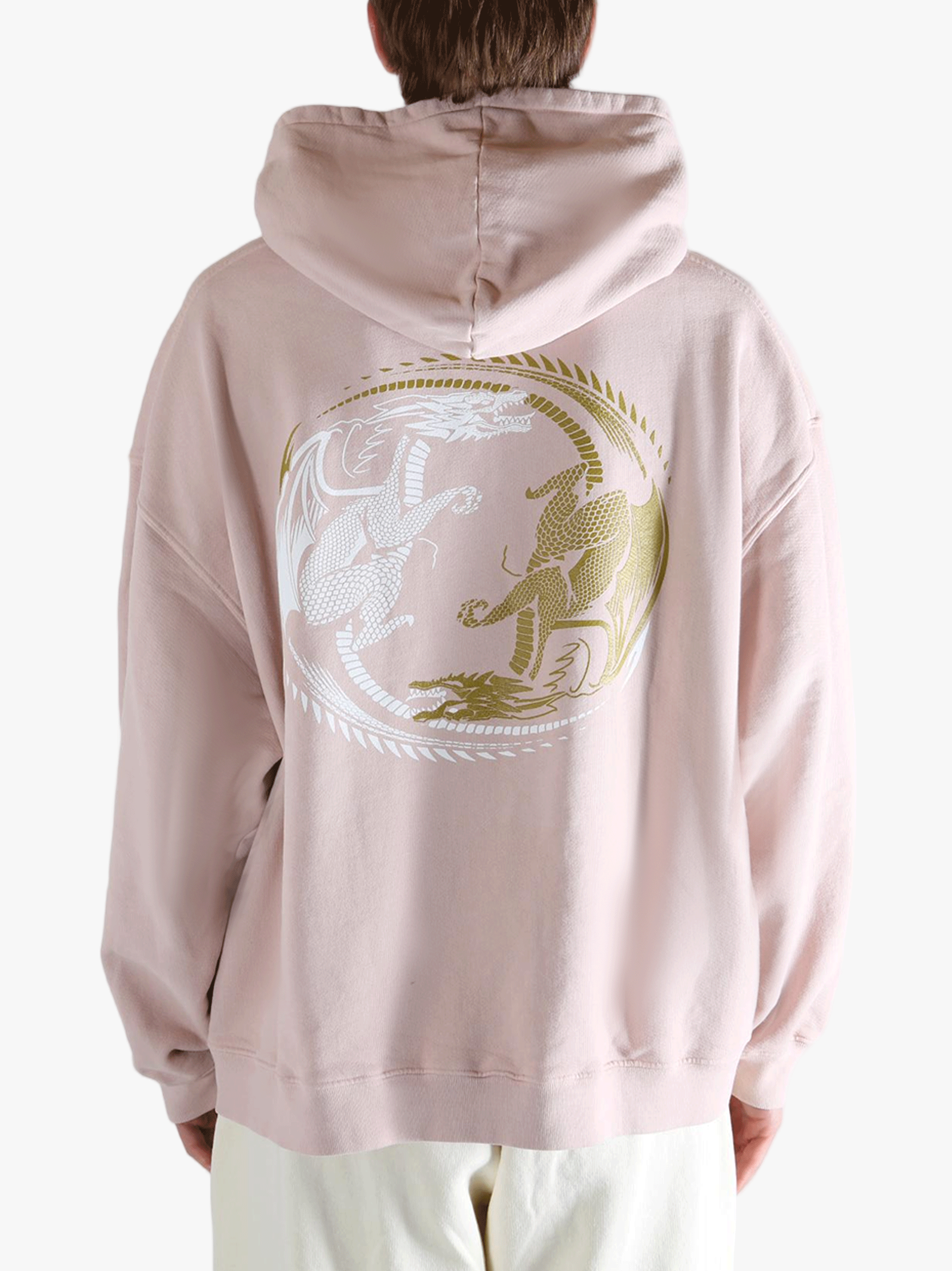 Pink hoodie worn by a person, showing the hoodie's fit