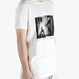 white t-shirts  worn by a person, showing the t-shirts fit