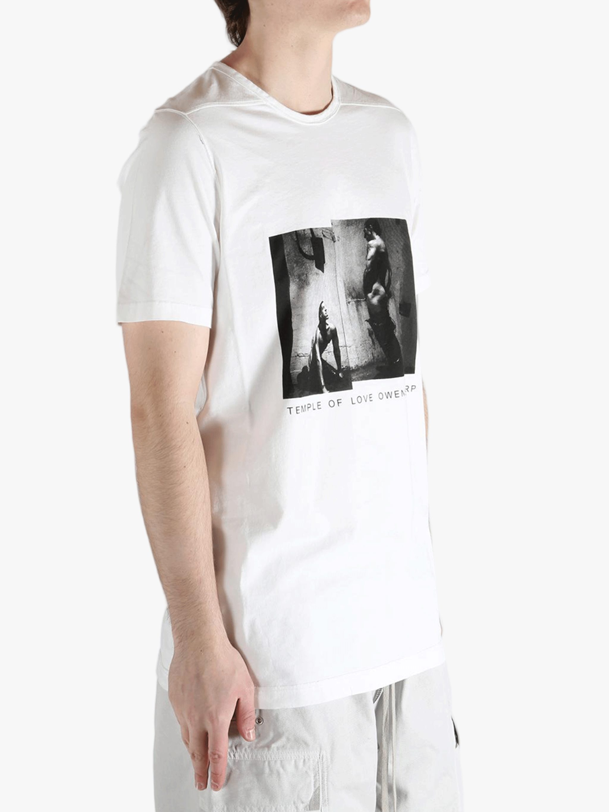 white t-shirts  worn by a person, showing the t-shirts fit