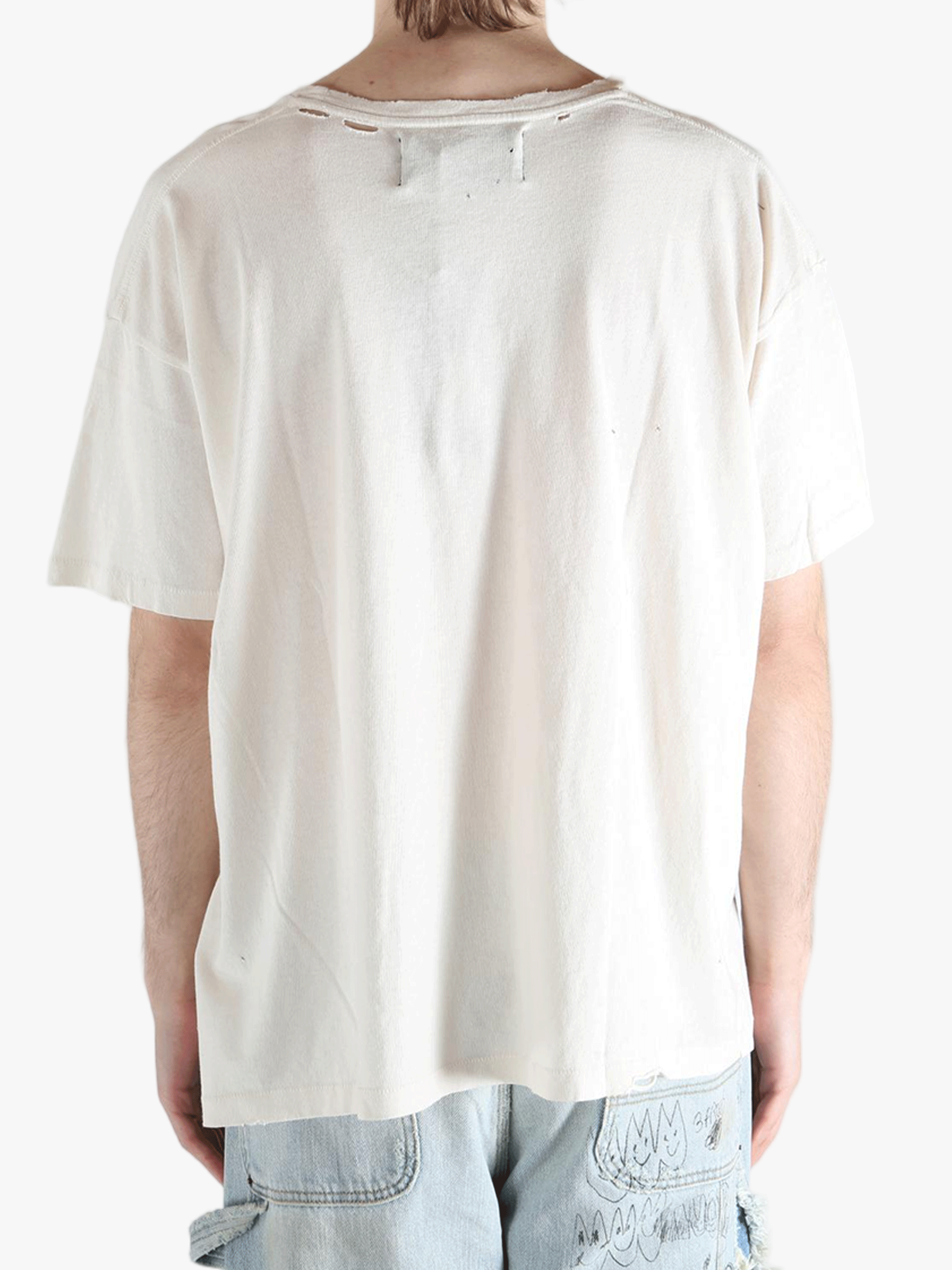 White t-shirt worn by a person, showing the shirt's fit