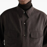 Brown shirt worn by a person, showing the shirt fit