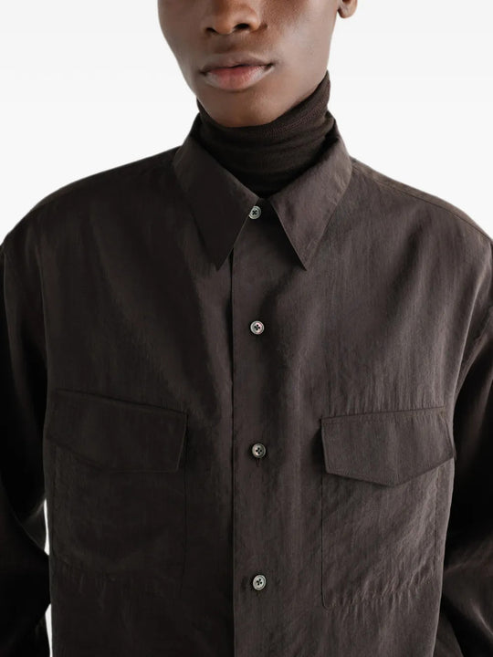 Brown shirt worn by a person, showing the shirt fit