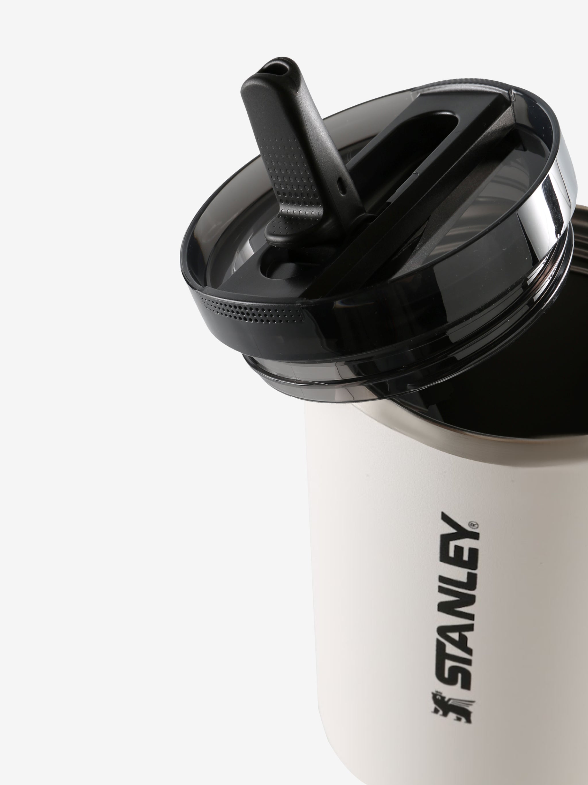 Close up of white tumbler, showing texture of the stainless steel fabric