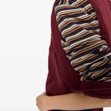 Close up of red shirt, showing texture of the Virgin Wool fabric