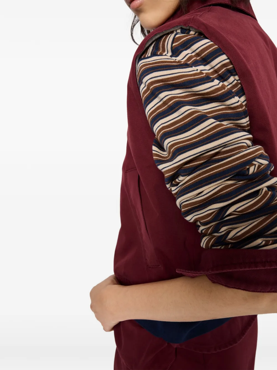 Close up of red shirt, showing texture of the Virgin Wool fabric