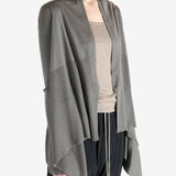 Grey knitwear worn by a person, showing the knitwear fit