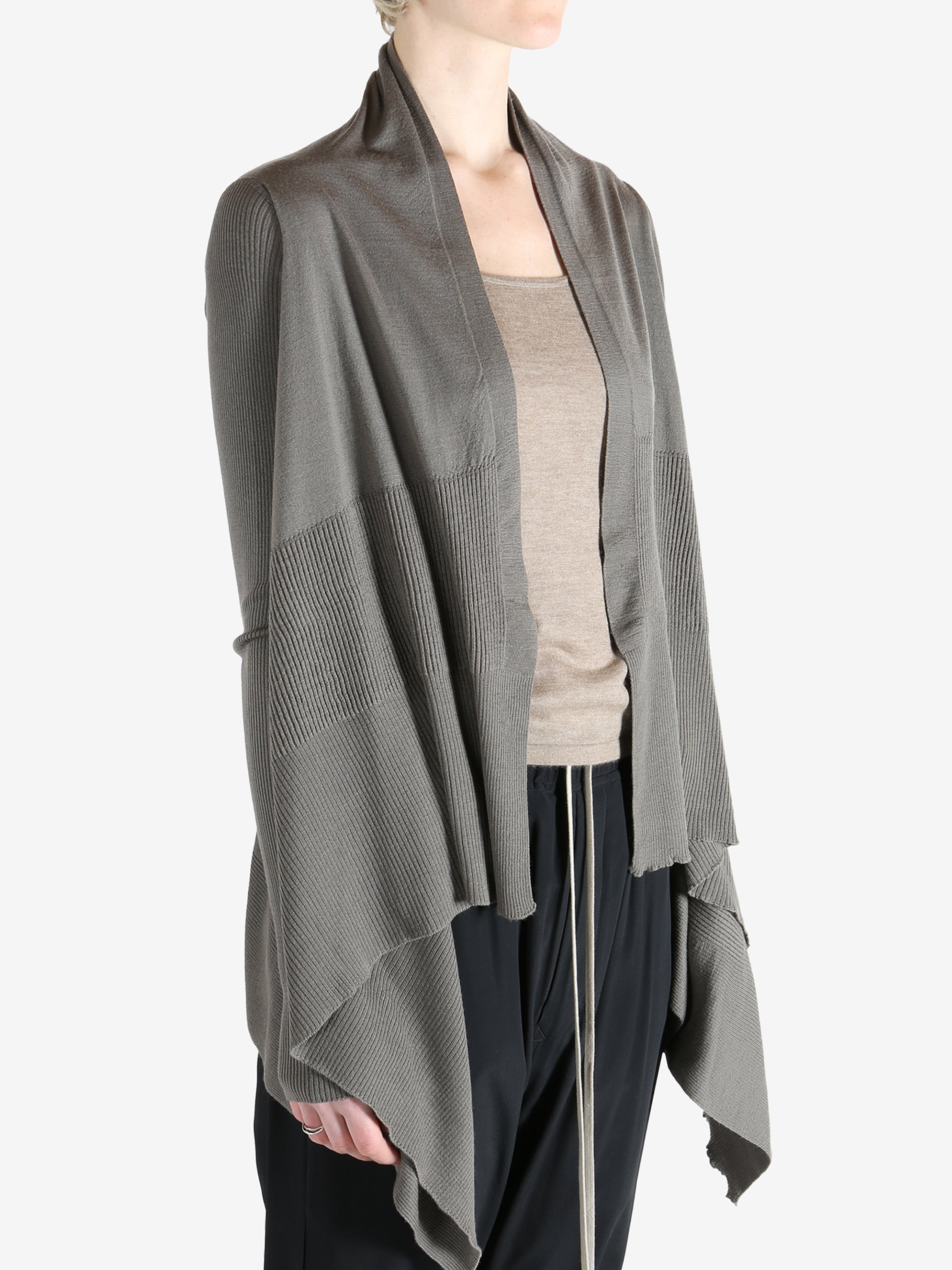 Grey knitwear worn by a person, showing the knitwear fit