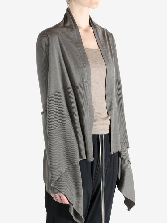 Grey knitwear worn by a person, showing the knitwear fit