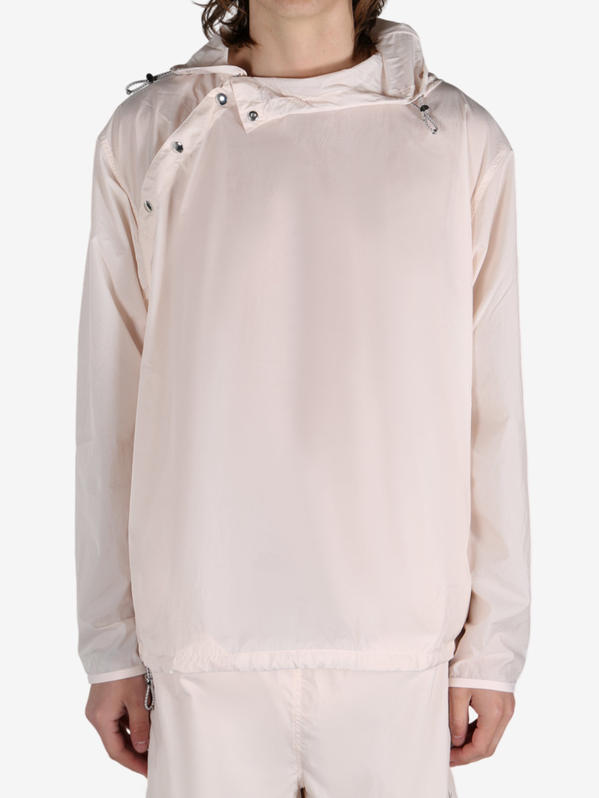 Pink jacket worn by a person, showing the jacket's fit