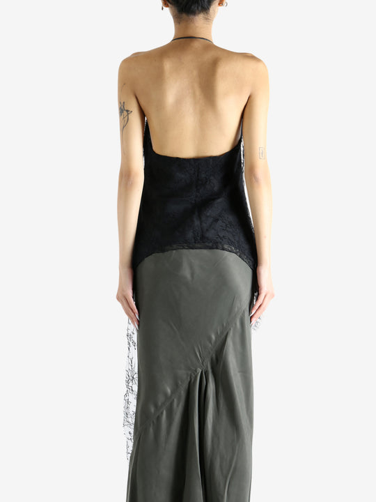 Black top worn by a person, showing the top's fit