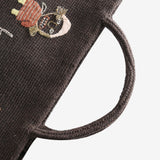 Close up of brown bag,showing texture of the wool fabric