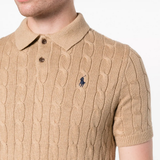 Tan knitwear worn by a person, showing the knitwear fit