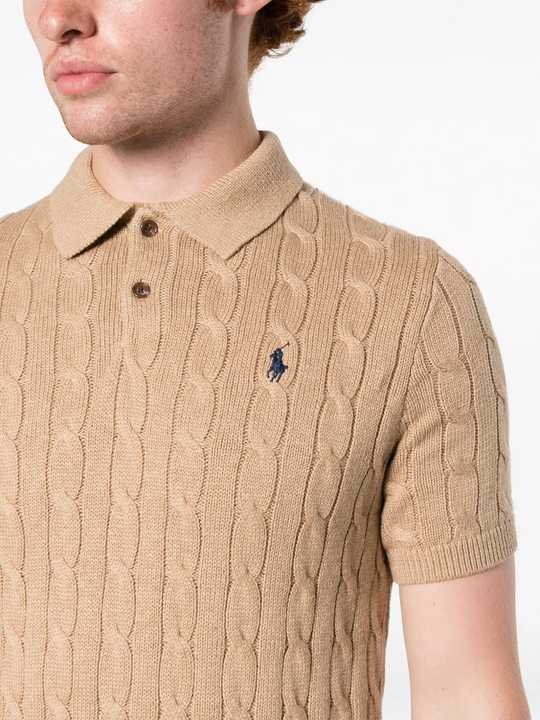 Tan knitwear worn by a person, showing the knitwear fit