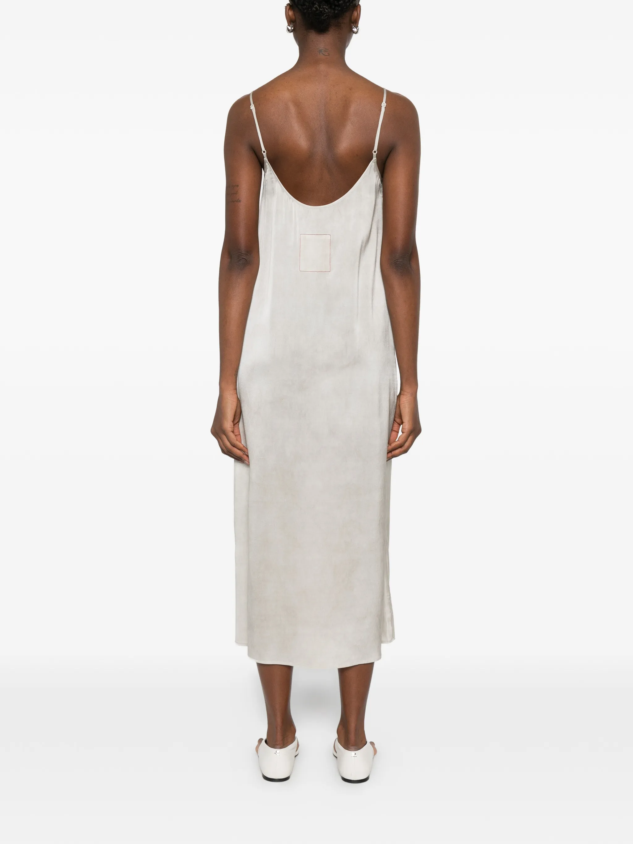 White dress worn by a person, showing the dress fit