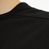 Black t-shirt worn by a person, showing the t-shirt fit