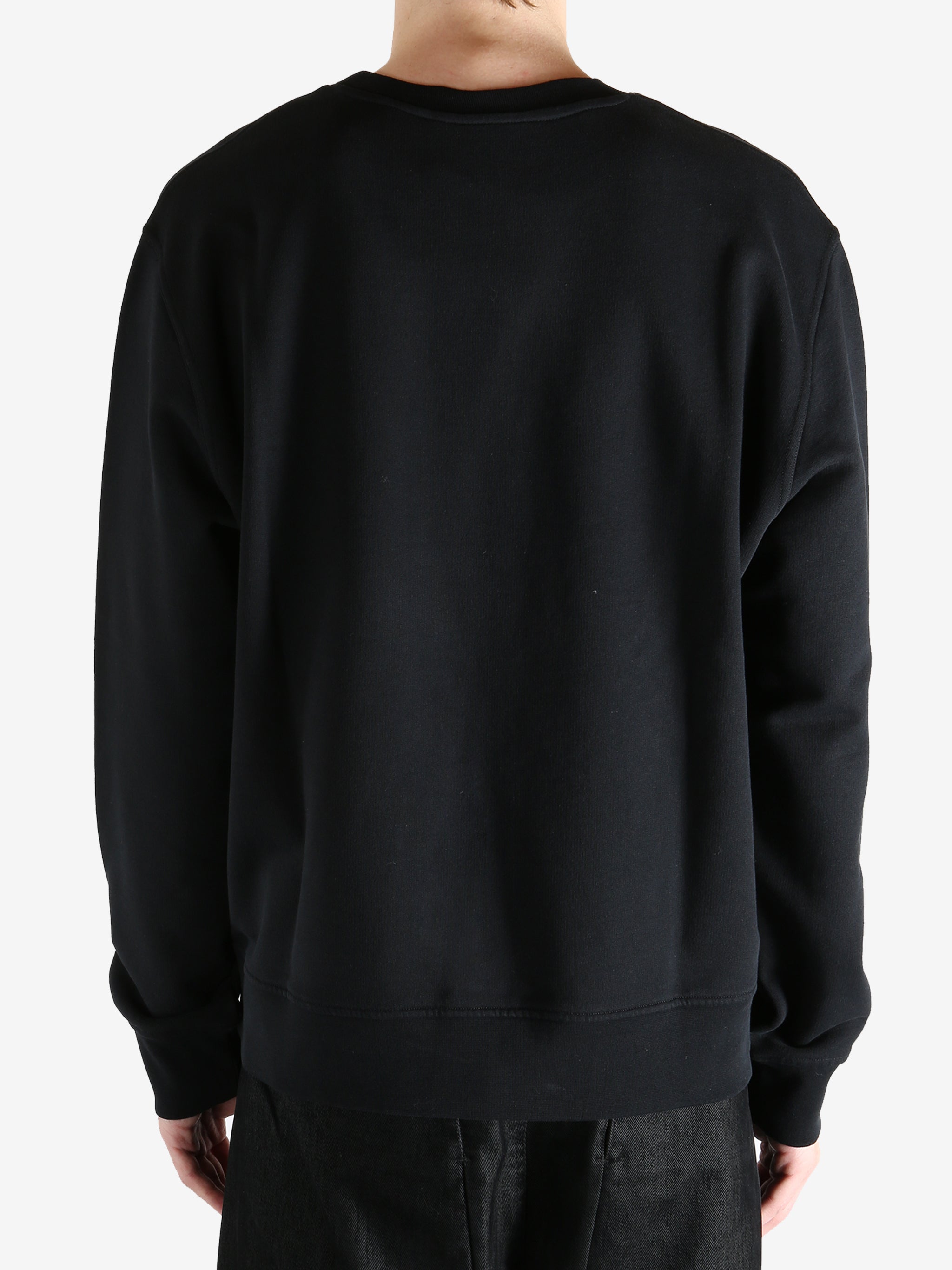 Black hoodies worn by a person, showing the hoodies fit