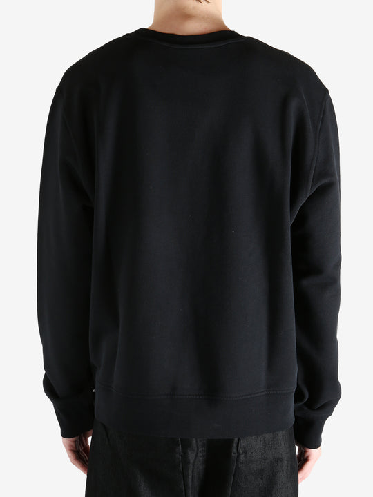 Black hoodies worn by a person, showing the hoodies fit