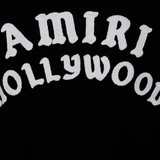 Close up of the black knitwear, showing texture of the cotton fabric