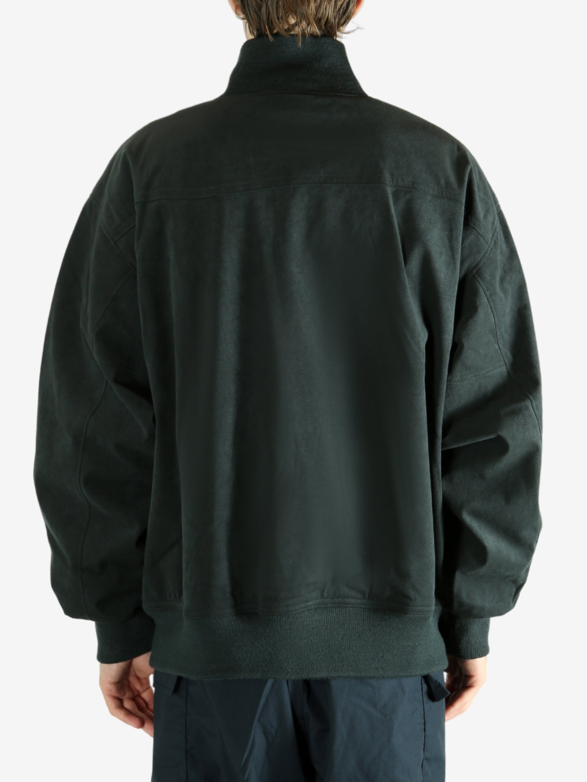 Grey jacket worn by a person, showing the jacket's fit