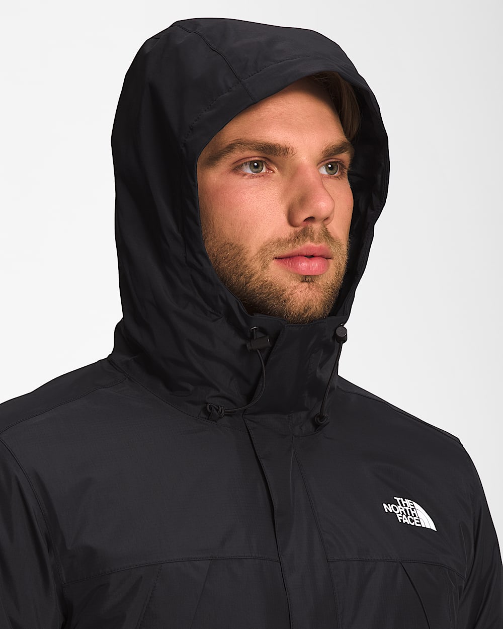 Black jacket worn by a person, showing the jacket fit