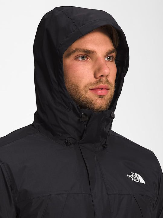 Black jacket worn by a person, showing the jacket fit