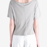 Grey knitwear worn by a person, showing the knitwear fit