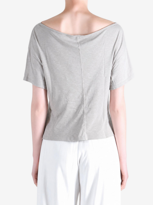 Grey knitwear worn by a person, showing the knitwear fit