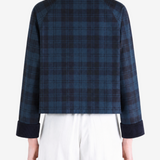 Blue jacket worn by a person, showing the jacket fit