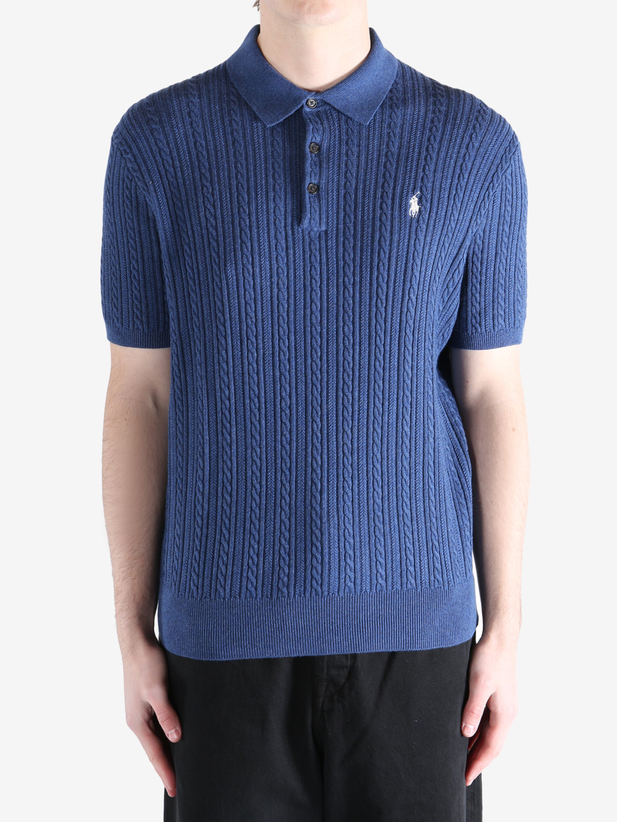 Navy t-shirt worn by a person, showing the shirt's fit