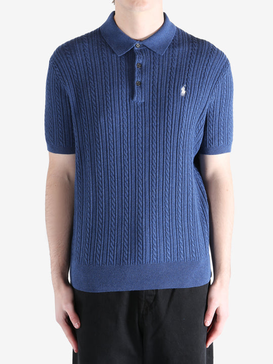 Navy t-shirt worn by a person, showing the shirt's fit