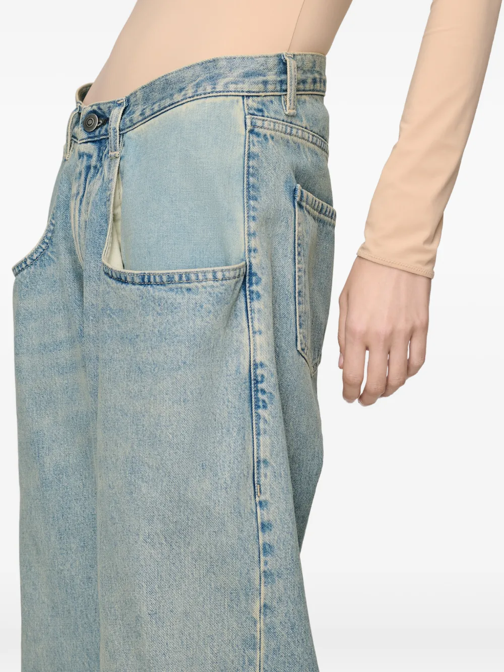 Close up of blue jeans, showing texture of the blended fabric