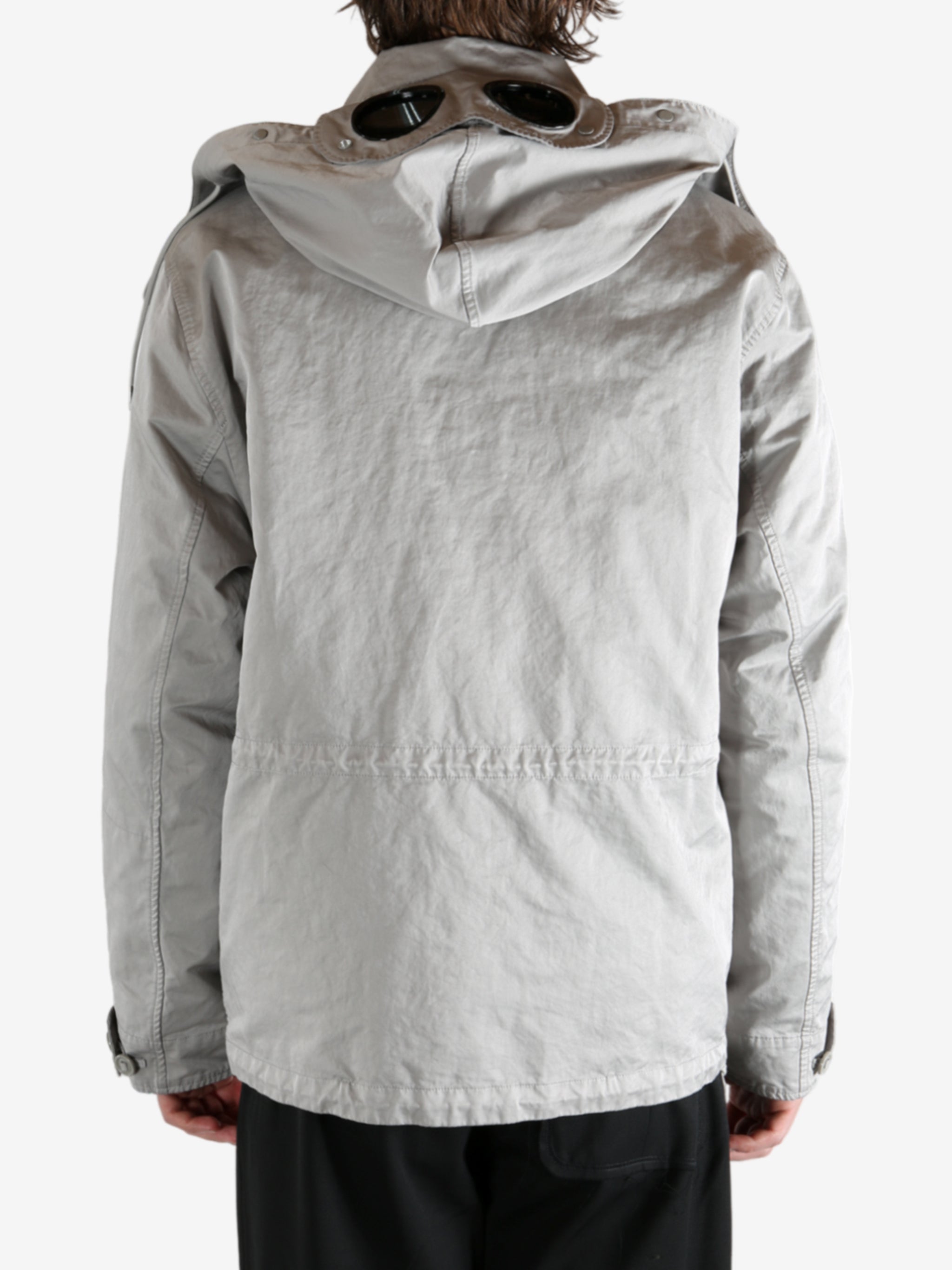 Grey jacket worn by a person, showing the jacket's fit