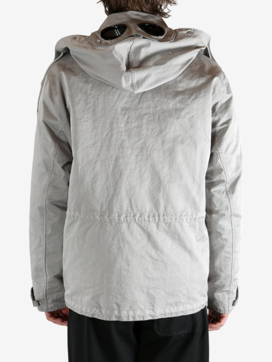 Grey jacket worn by a person, showing the jacket's fit