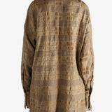 Brown top worn by a person, showing the top fit