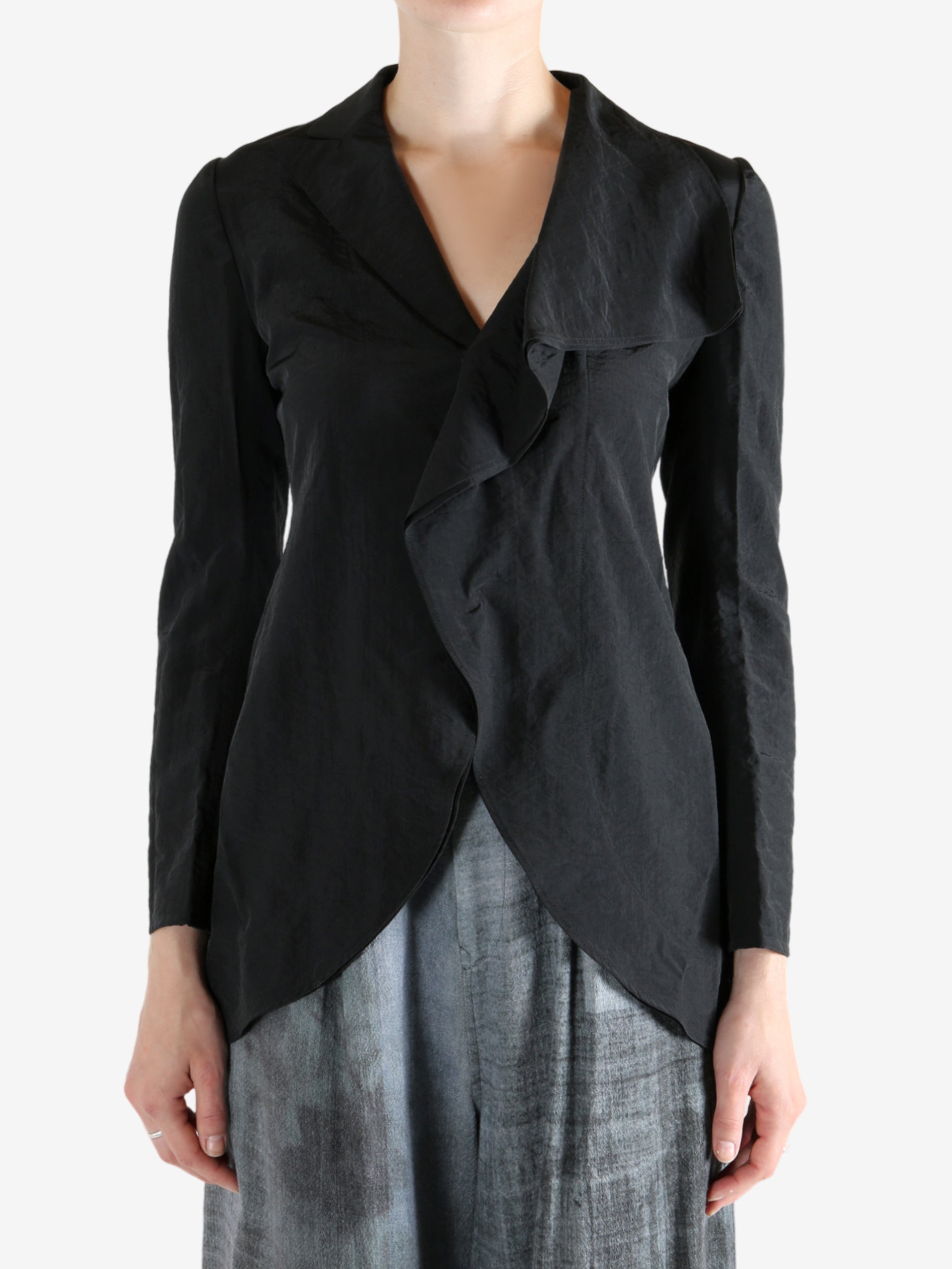 Black jacket worn by a person, showing the jacket's fit