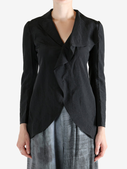 Black jacket worn by a person, showing the jacket's fit