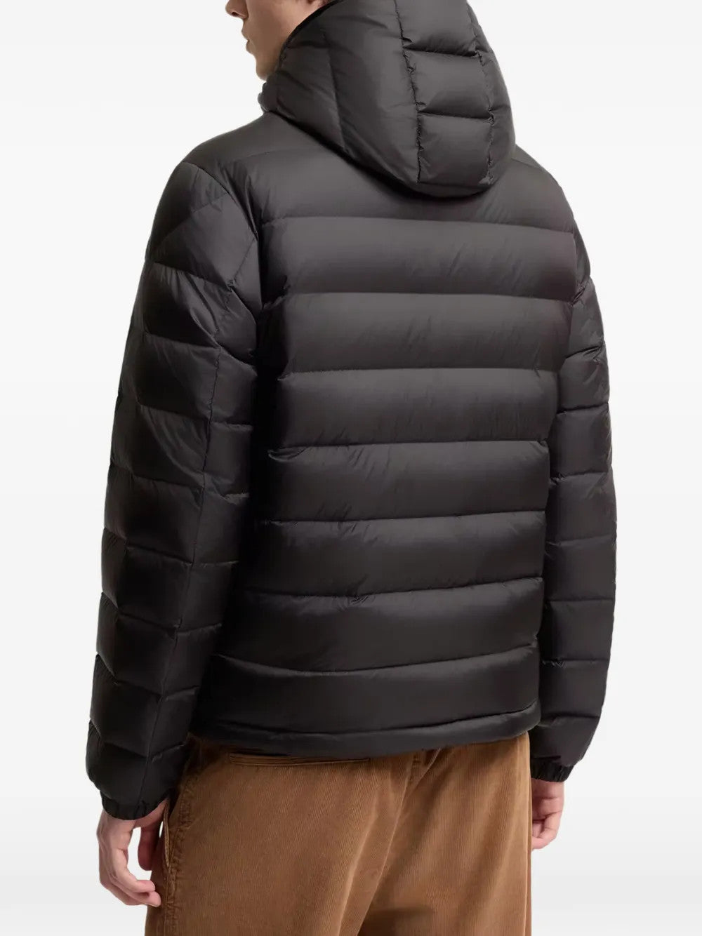 Black jacket worn by a person, showing the jacket fit