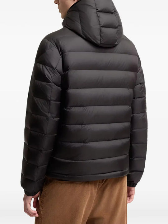 Black jacket worn by a person, showing the jacket fit