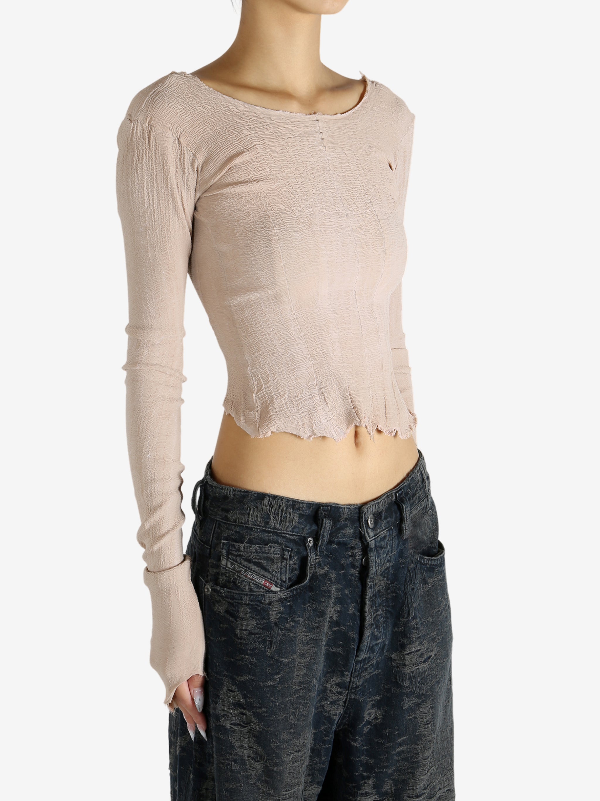 Tan top worn by a person, showing the top's fit