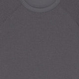 Close up of the grey t-shirt, showing texture of the polyester fabric