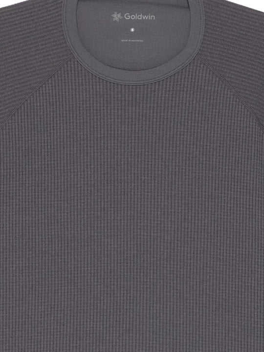 Close up of the grey t-shirt, showing texture of the polyester fabric