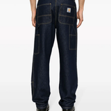 Black pants worn by a person, showing the pants fit