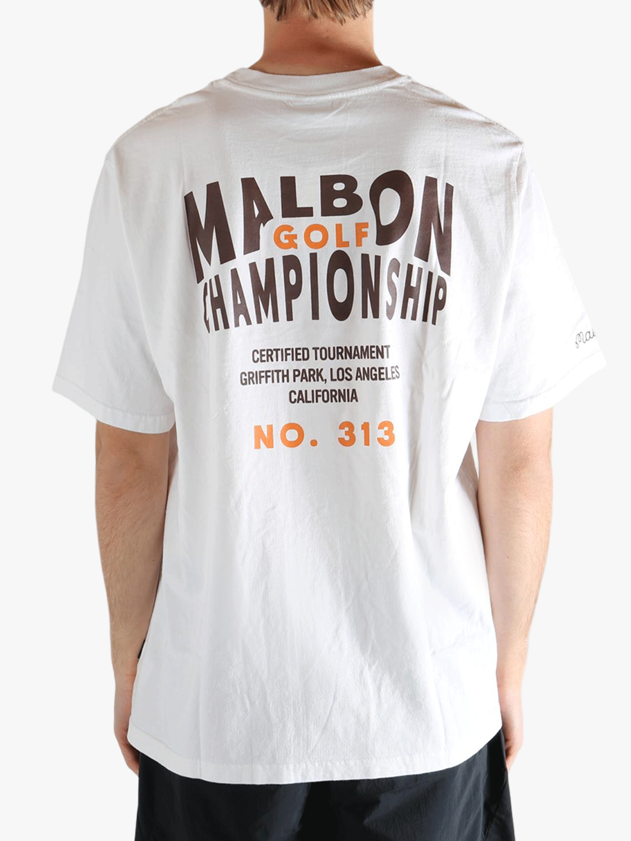 White t-shirt worn by a person, showing the t-shirt's fit