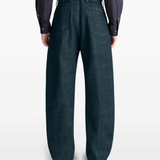 Navy pants worn by a person, showing the pants fit