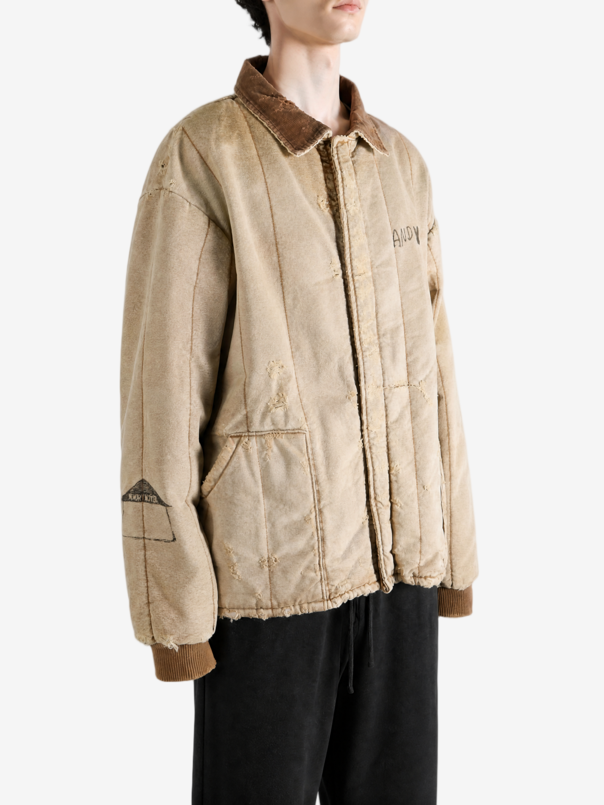 Tan jacket worn by a person, showing the jacket fit