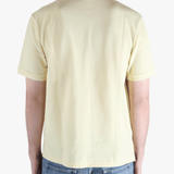 Tan shirt worn by a person, showing the fit